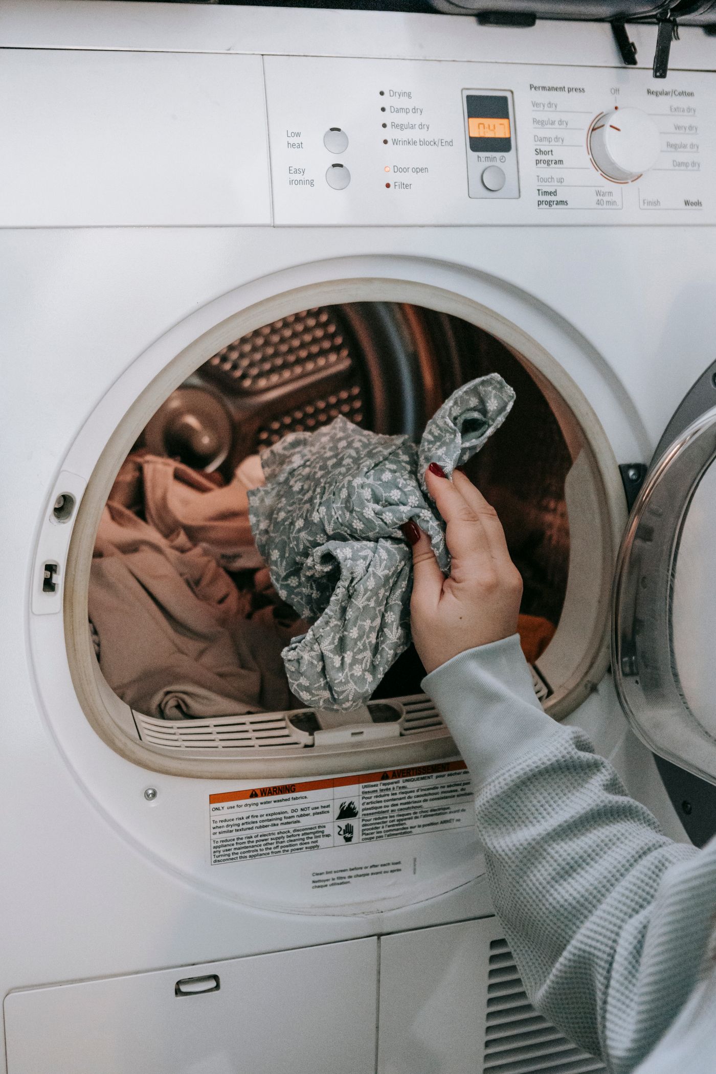 Loading laundry into a front load washing machine
